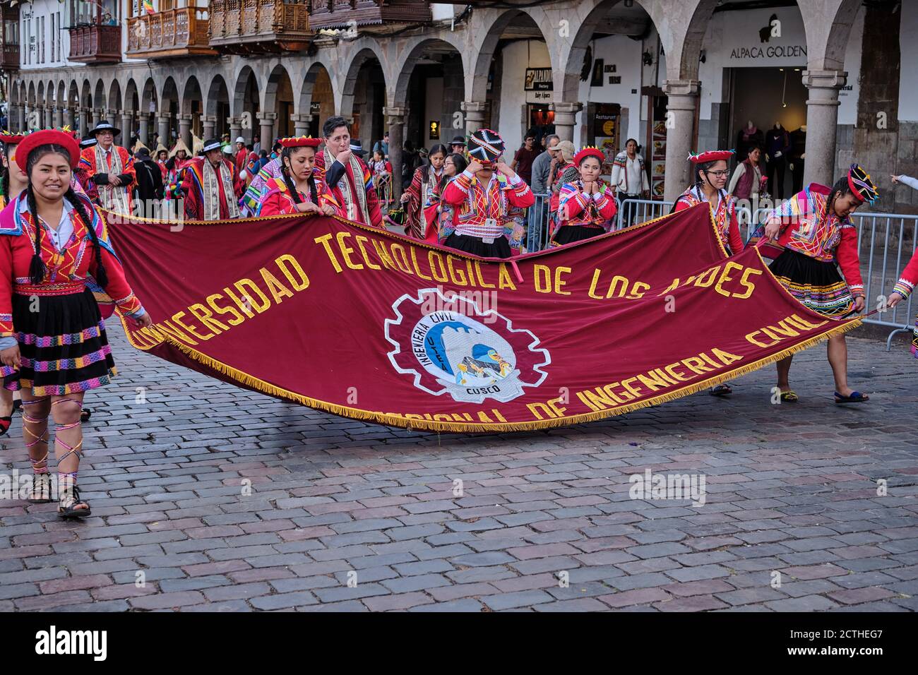 Civil engineering students from the Technical University of the Andes march in colourful costume with a banner during the Inti Raymi'rata sun festival Stock Photo