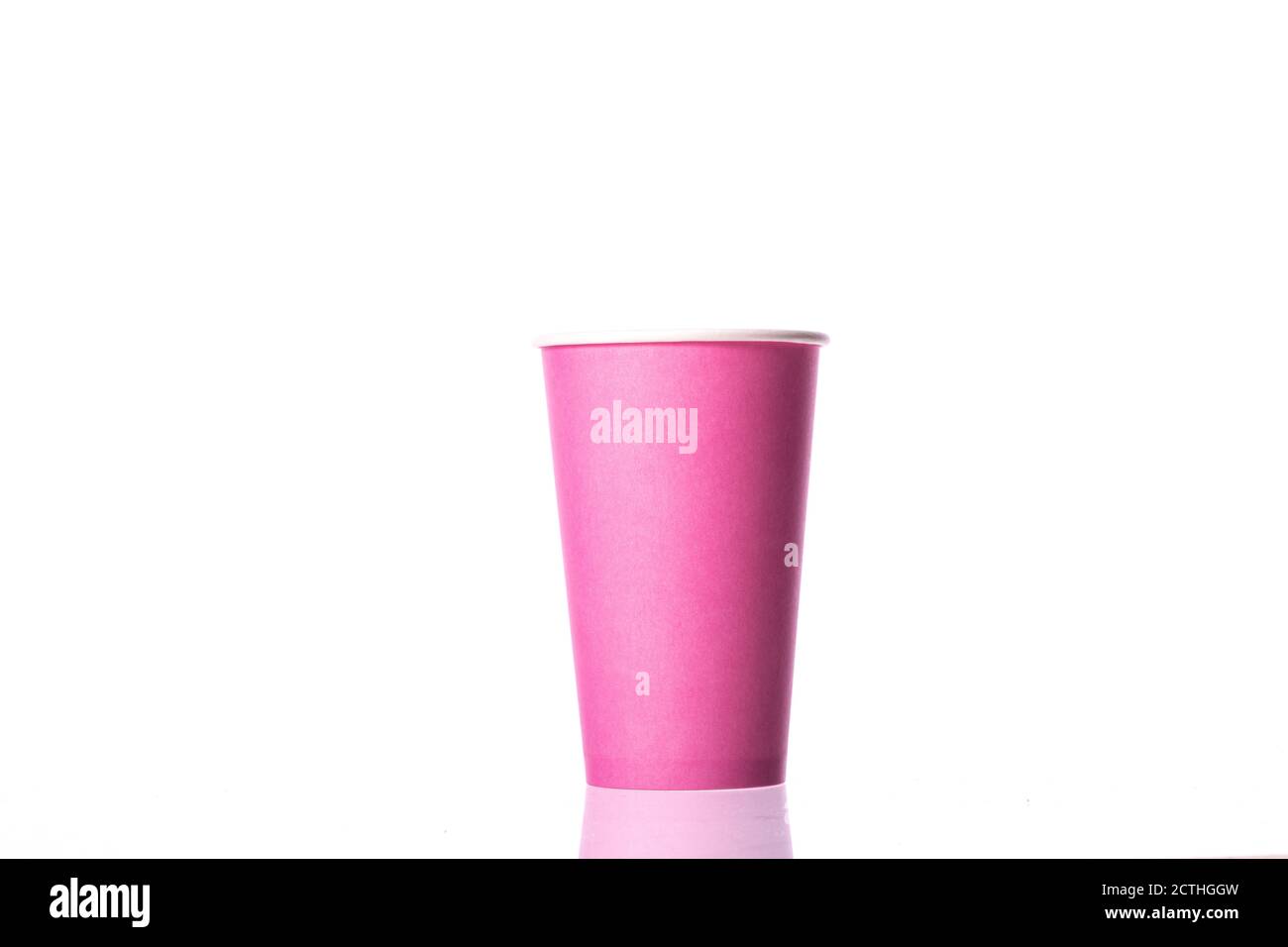 Disposable pink blank paper cup isolated on white background. Coctails party Stock Photo