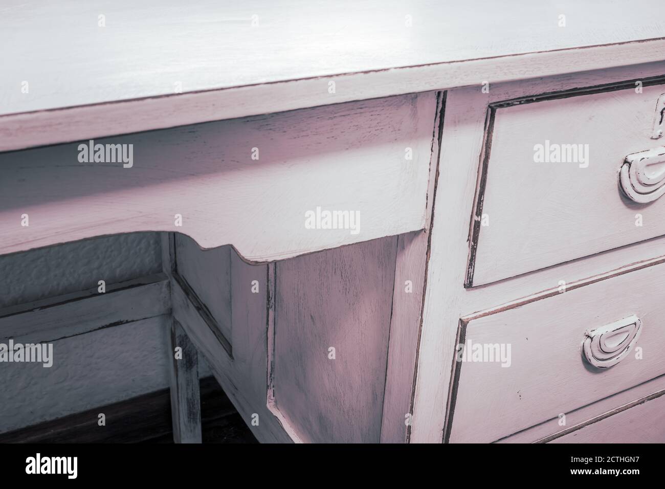 Old White wooden work desk, with three draws, inside a bedroom, South