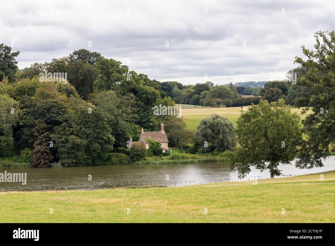 Lakeside cottage near the lake and in the parkland of Bowood House & Gardens, Wiltshire, England, UK Stock Photo