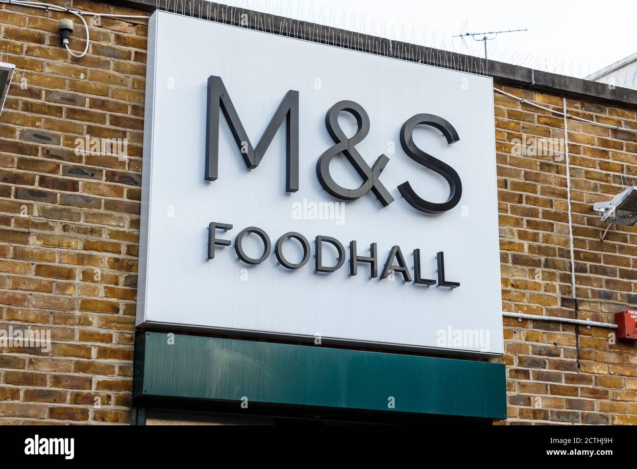 Sign above M&S Foodhall on Camden High Street, London, UK Stock Photo
