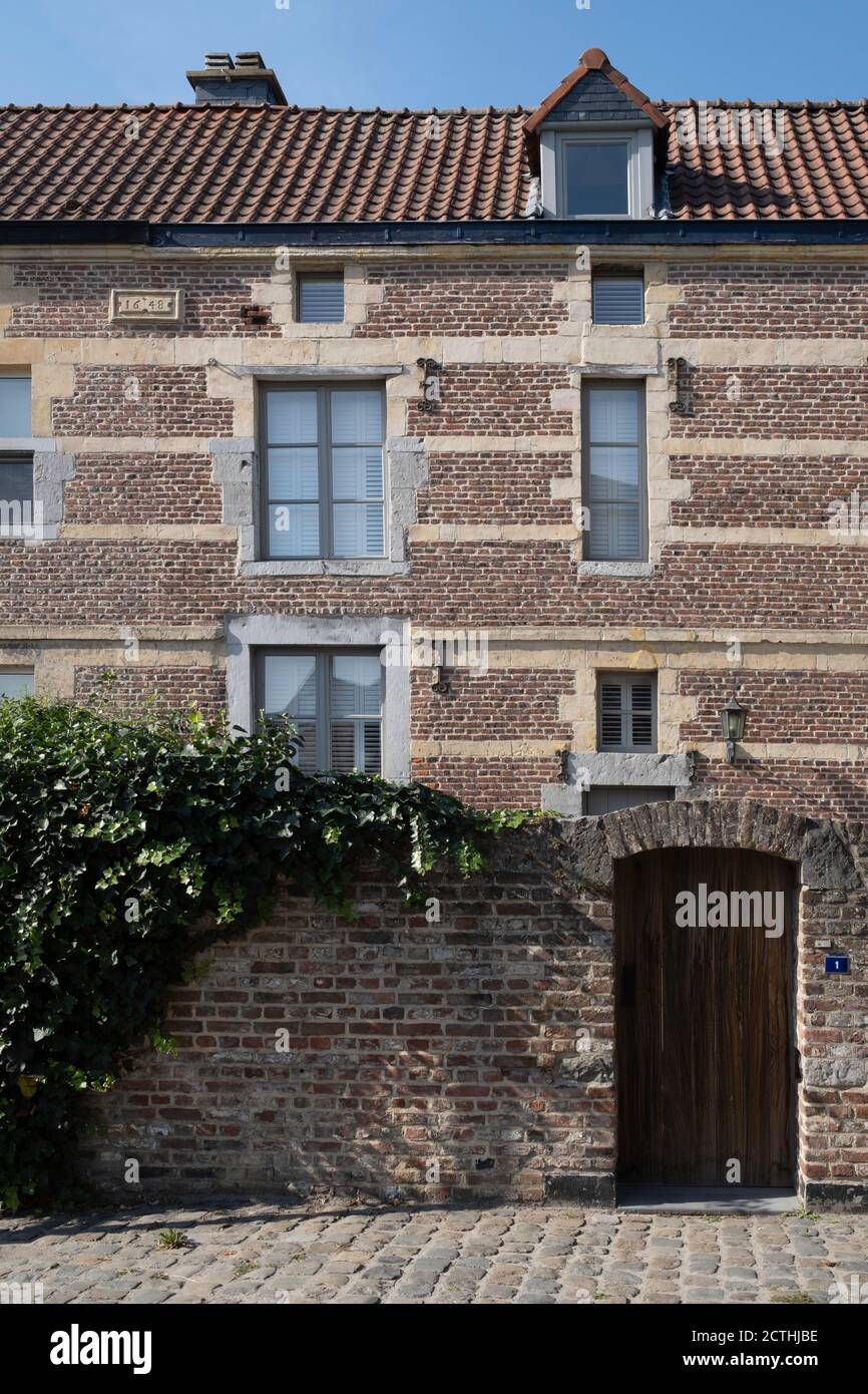 Facades of restored houses at the Begijnhof or Beguinage in the streets
