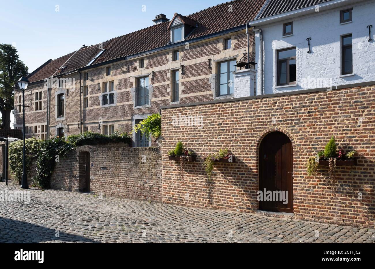Facades of restored houses at the Begijnhof or Beguinage in the streets