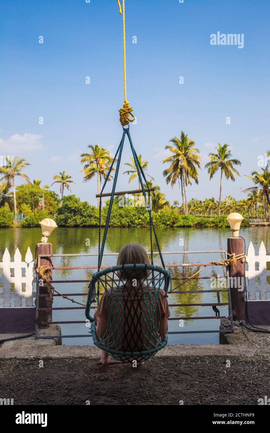 India, Kerala, Kollam, Resort on Munroe Island, Tourist in hanging