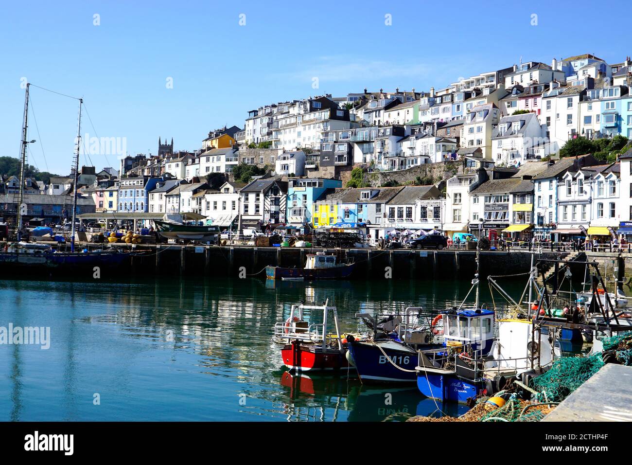 Brixham, Devon, UK. September 14, 2020. Beautiful architecture and quayside with fishing boats at moorings in the harbour at Brixham in Devon, UK. Stock Photo