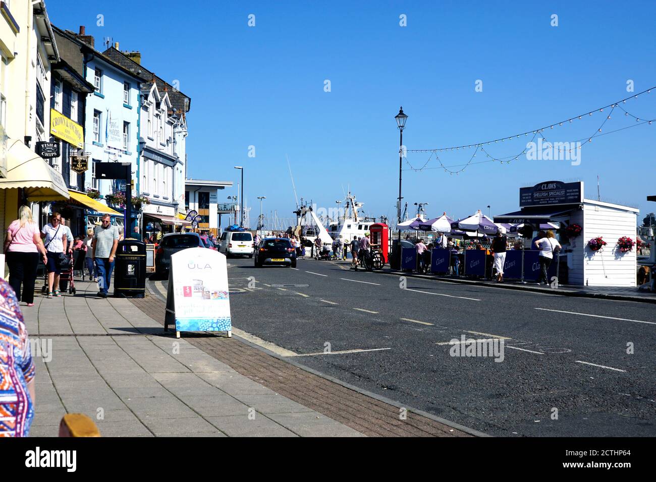 Brixham, Devon, UK. September 14, 2020. Tourists and holidaymakers enjoying the quayside and harbour at Brixham in Devon, UK. Stock Photo