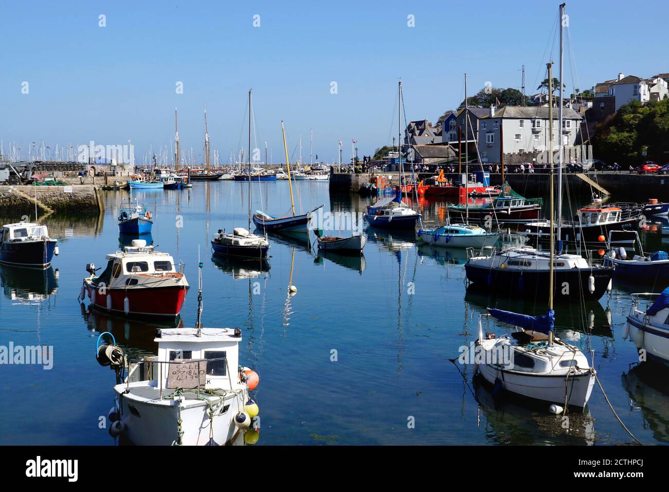 Brixham, Devon, UK. September 14, 2020. Tourists and holidaymakers on the Quayside browse the beautiful inner and outer harbours at Brixham in Devon, Stock Photo