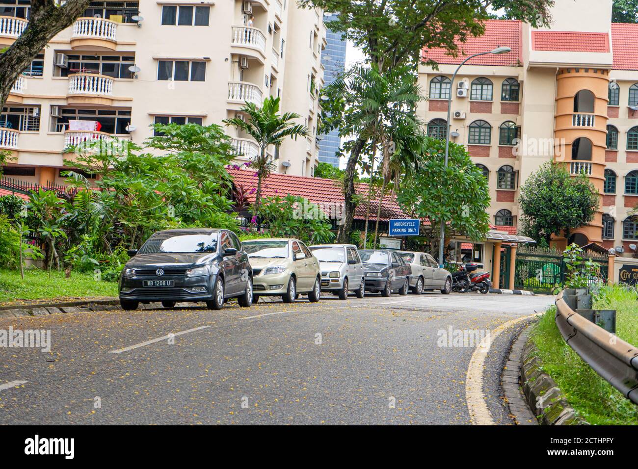 Street Sidelines Cars parked on the sidelines in a row. Street in Malaysia. Kuala Lumpur ...