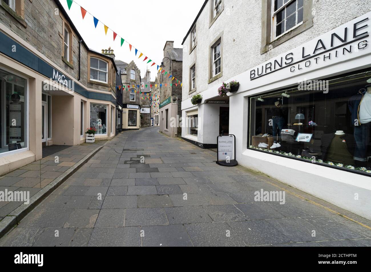 View of shops along deserted Commercial Street in old town of Lerwick, Shetland Isles, Scotland, UK Stock Photo