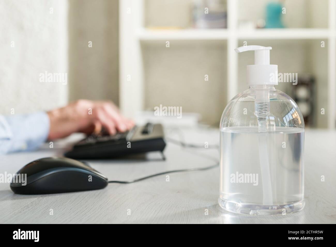 Antibacterial gel dispenser on office desk Stock Photo Alamy