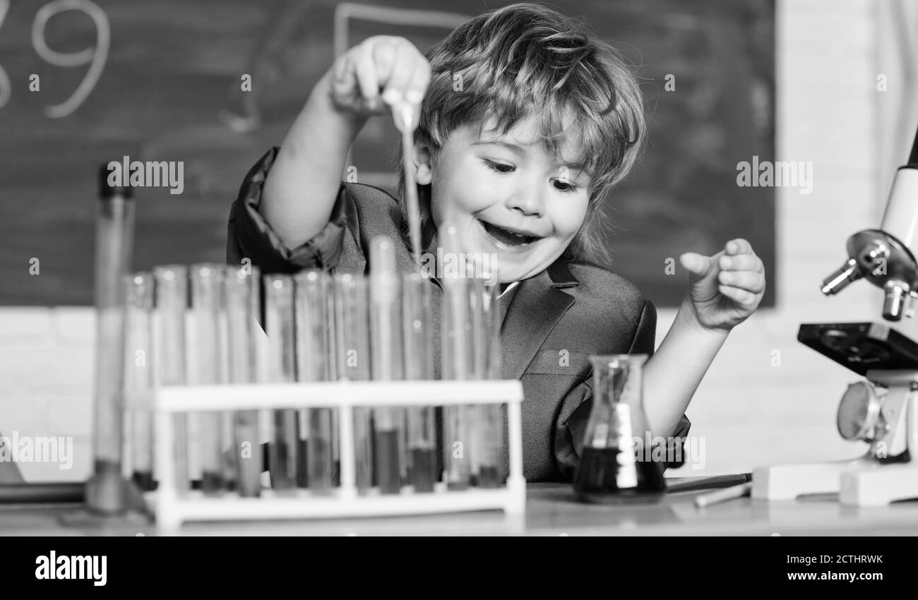 Biology school laboratory equipment. Little kid learning chemistry in