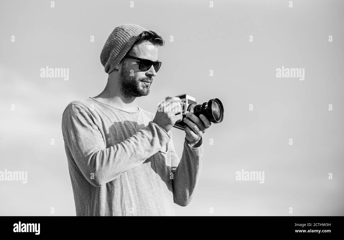 Photojournalist concept. Guy photographer outdoors sky background ...