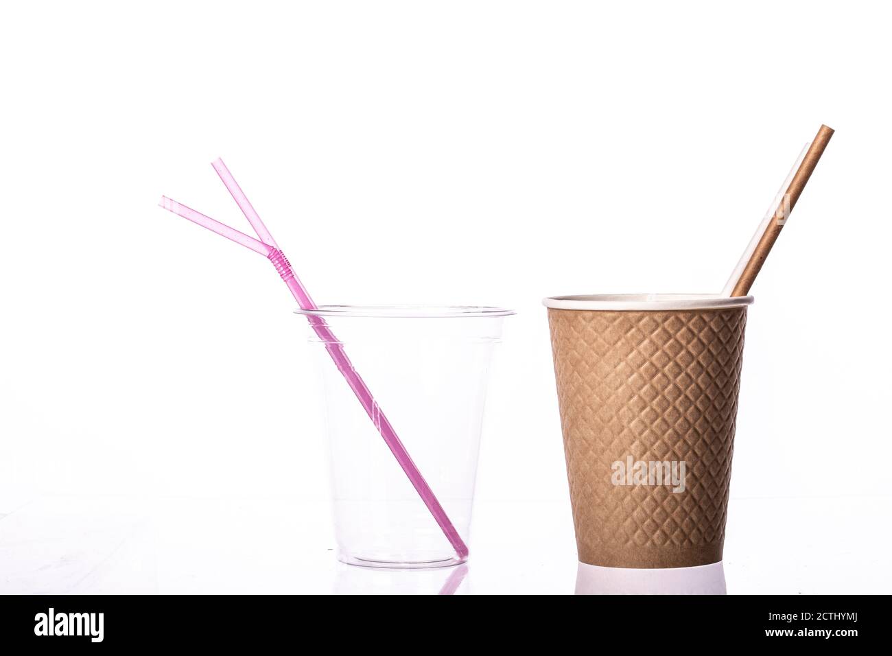 Plastic vs natural materials. Transparent plastic cup straws and craft