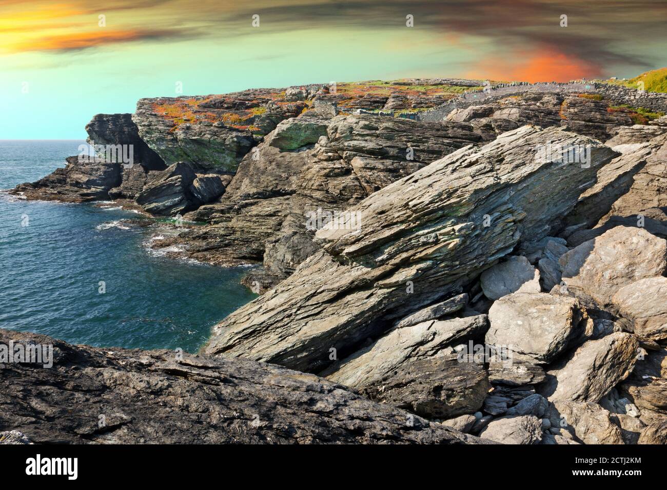 Penrhos Bay near Trearddur on Holy Island, Anglesey, North Wales, is a small cove with dramatic cliffs composed of Precambrian rock. Stock Photo