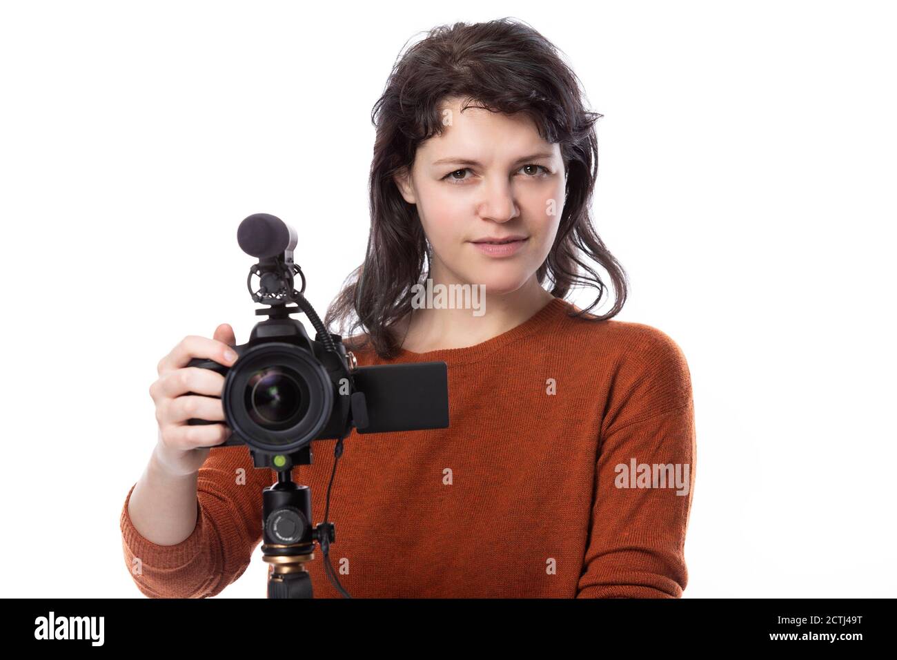 Young female with a camera and mic as a filmmaker or online content creator  on a white background. She looks like a film student looking disgusted by  Stock Photo - Alamy