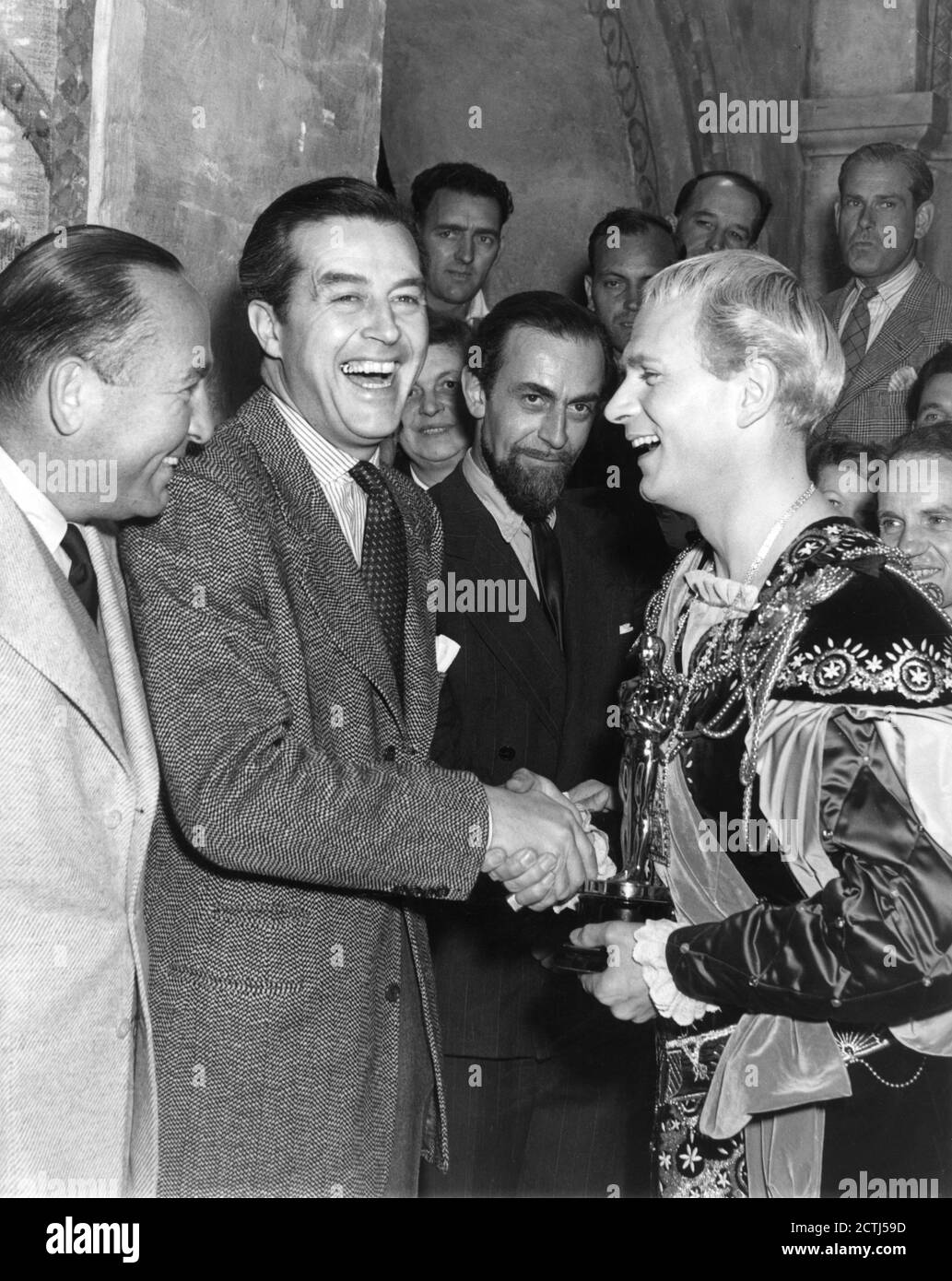 Producer HAL B. WALLIS and RAY MILLAND present LAURENCE OLIVIER with ...