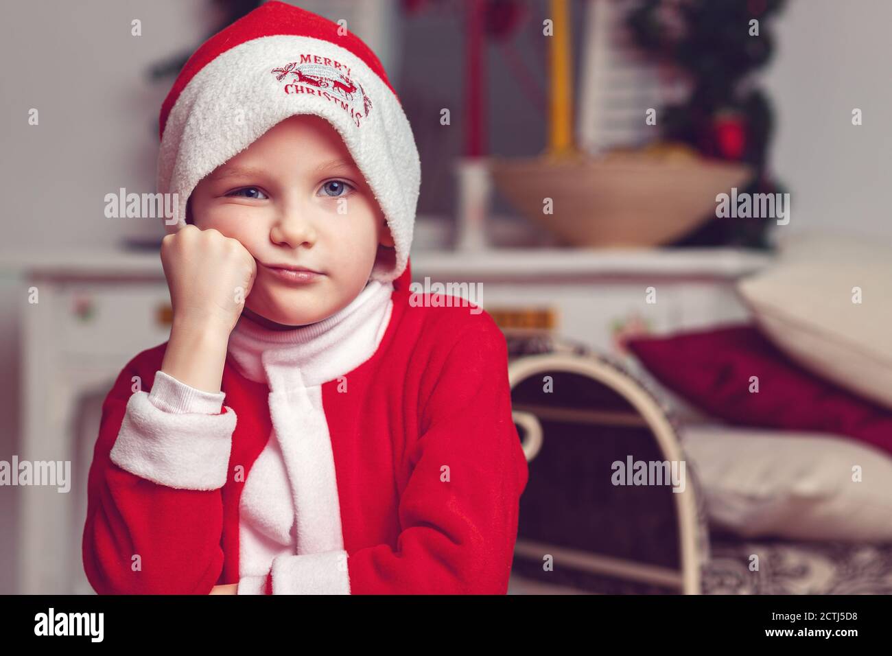 Young small boy in santa claus outfit hires stock photography and