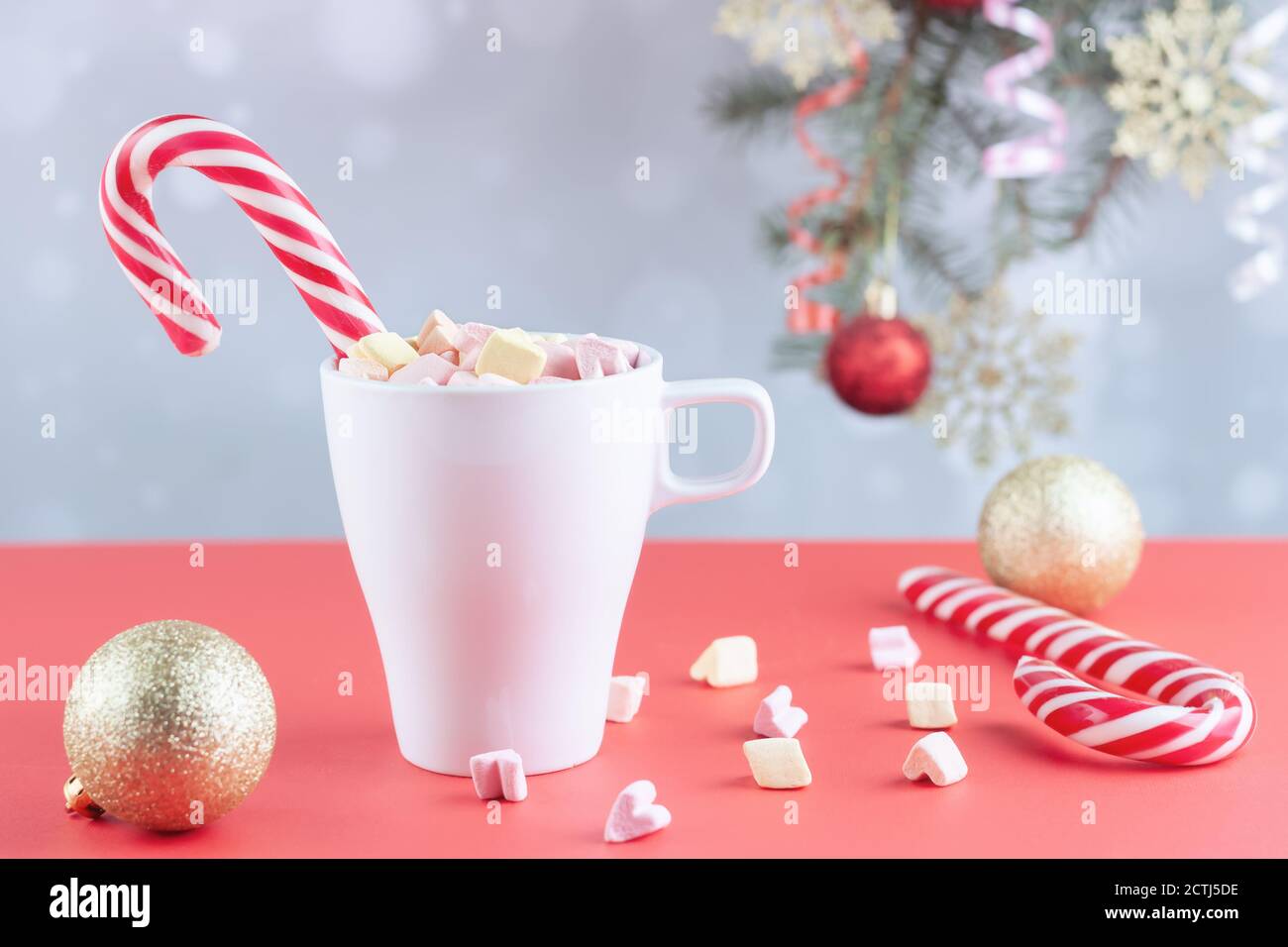 marshmallows and a cup of latte on a white table Stock Photo