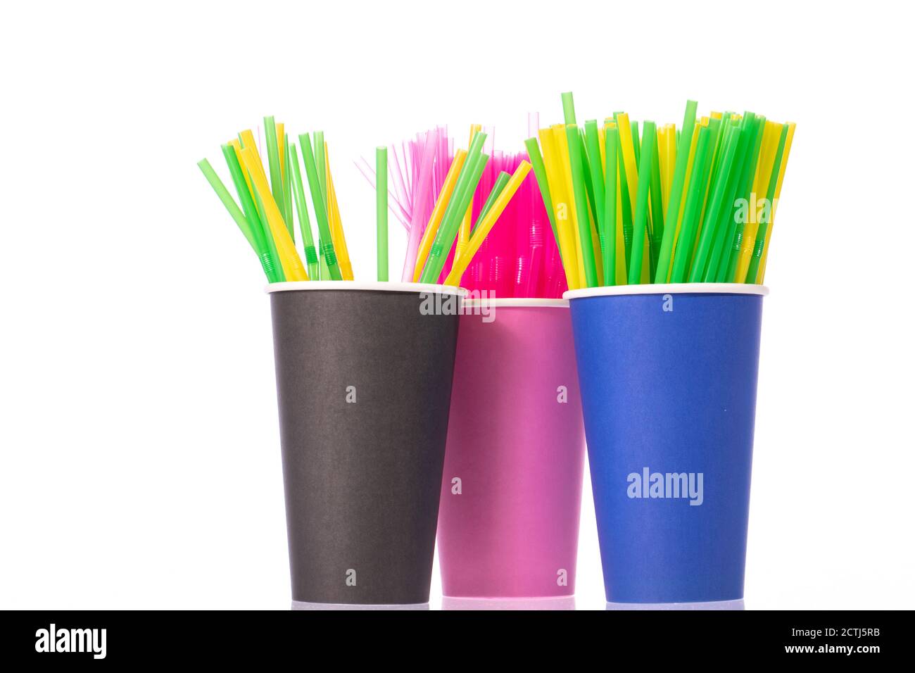 Colored plastic drinking straws in disposable cups isolated on white background Stock Photo