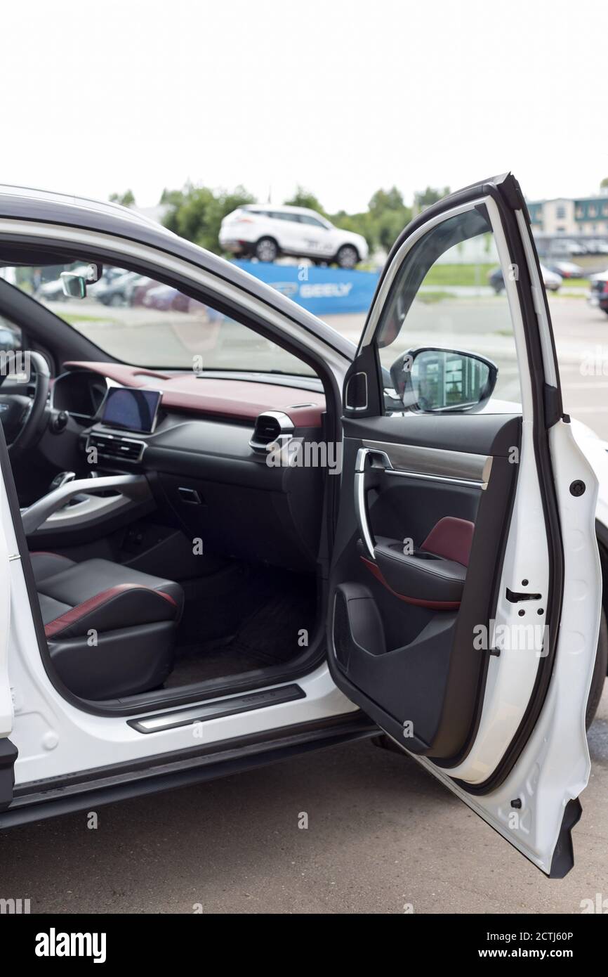 Russia, Izhevsk - August 14, 2020: Geely showroom. Front passenger door and leather passenger seat inside CoolRay car. Interior of new modern car. Stock Photo
