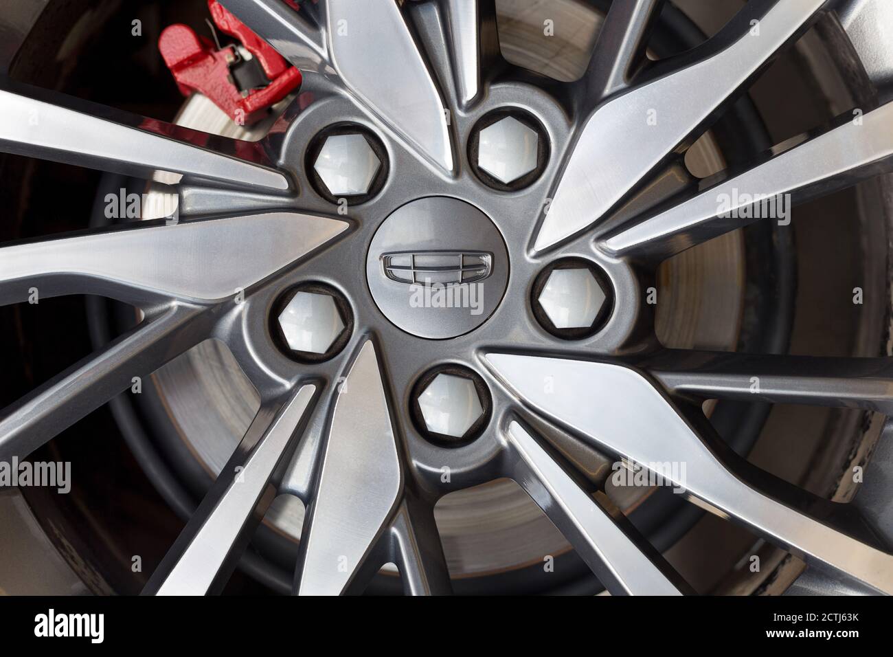 Russia, Izhevsk - August 14, 2020: Geely showroom. The alloy wheel of a new CoolRay car. Cropped image. Car manufacturer from China. Stock Photo