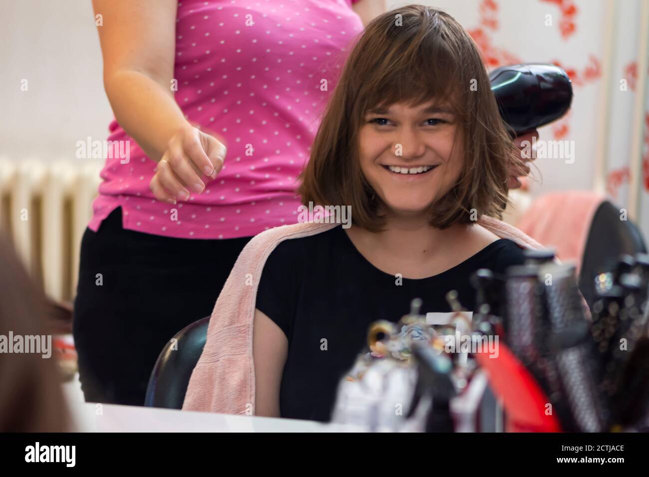 Portrait of young girl in hair salon Stock Photo - Alamy