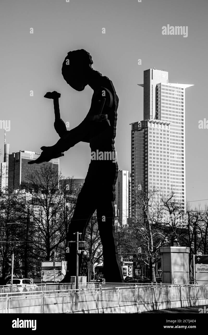 Frankfurt, Hesse, Germany: 'Hammering Man' by Jonathan Borofsky, a monumental kinetic sculpture of a painted steel silhouette of a man with a hammer. Stock Photo