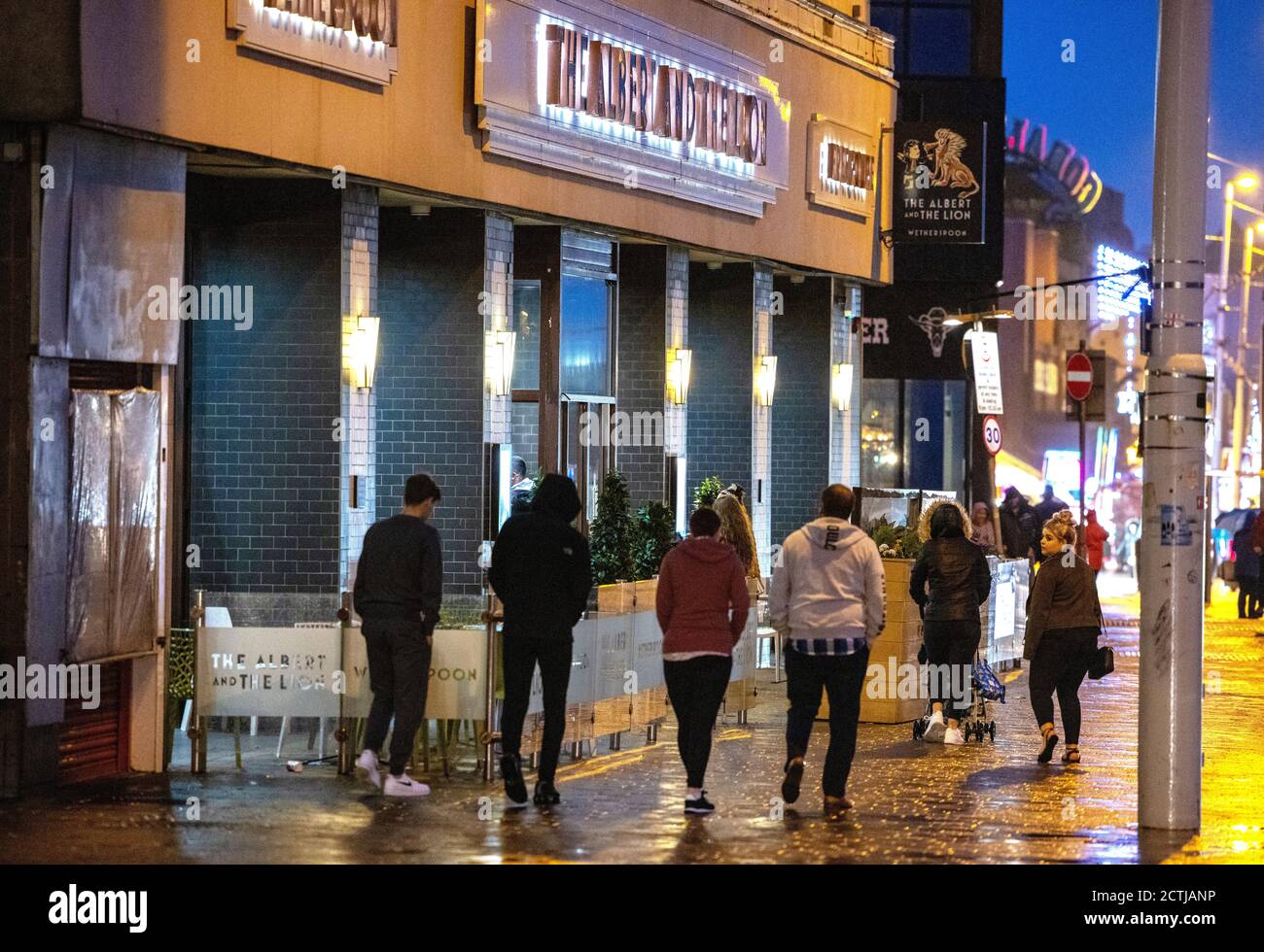 People outside a Wetherspoons pub in Blackpool. All pubs, bars, restaurants in England must have a 10pm closing time from Thursday, to help curb the spread of coronavirus. Stock Photo