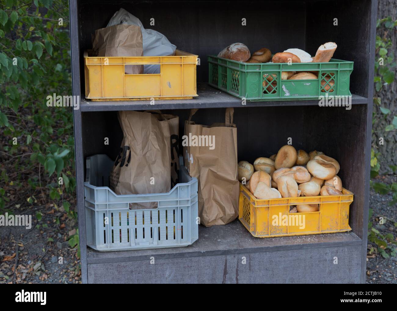 boxes and paper bags with old bread as a donation for animals Stock Photo