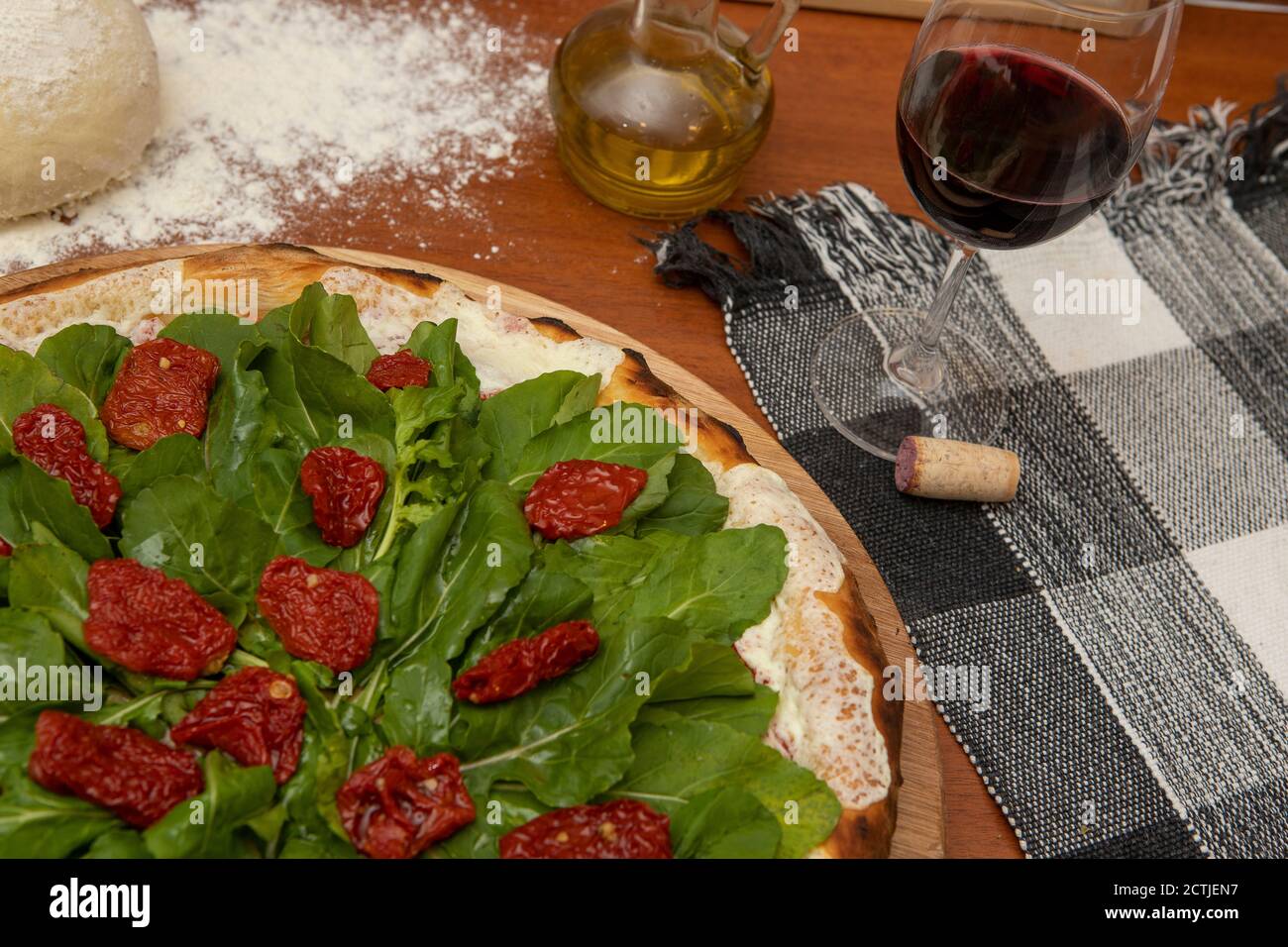 Pizza with mozzarella, rucula and dried tomato Stock Photo