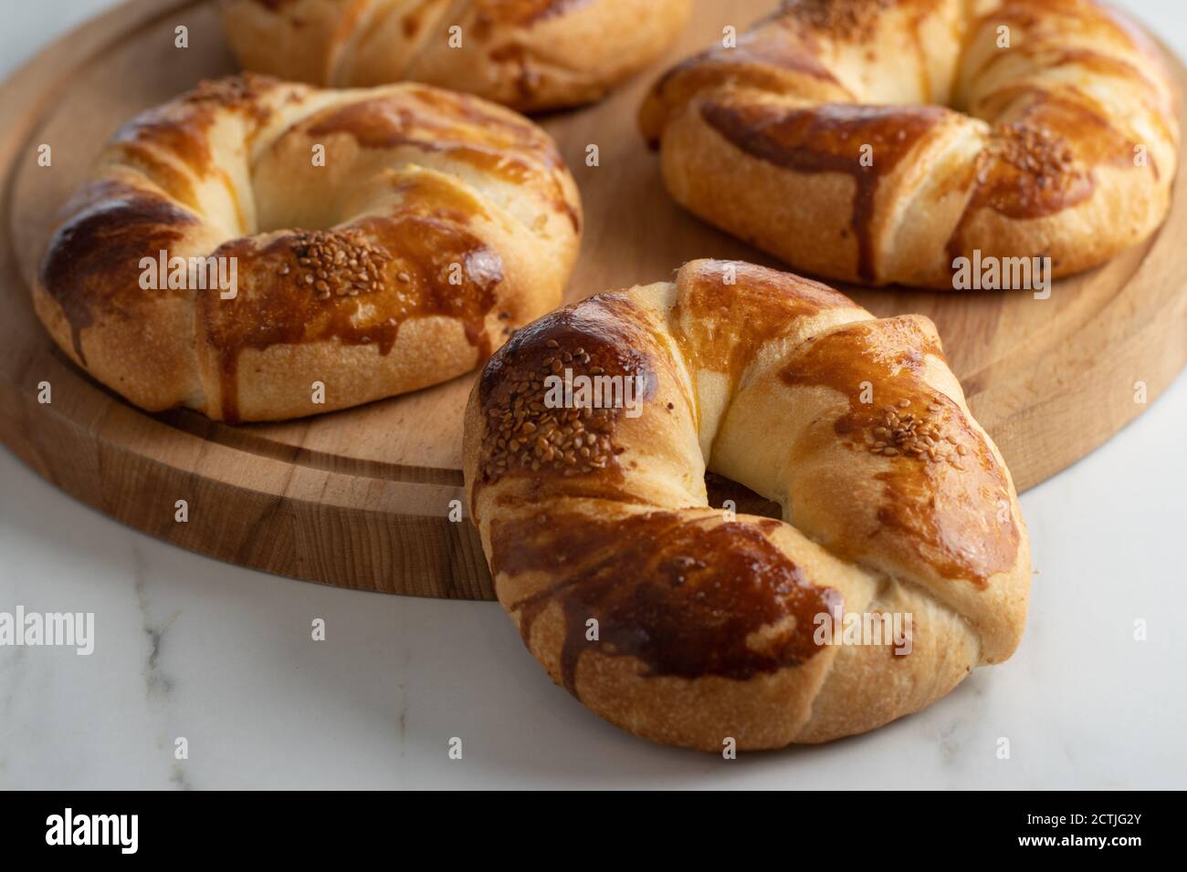 Turkish pastry simit bagel and pogaca on wood plate Stock Photo - Alamy