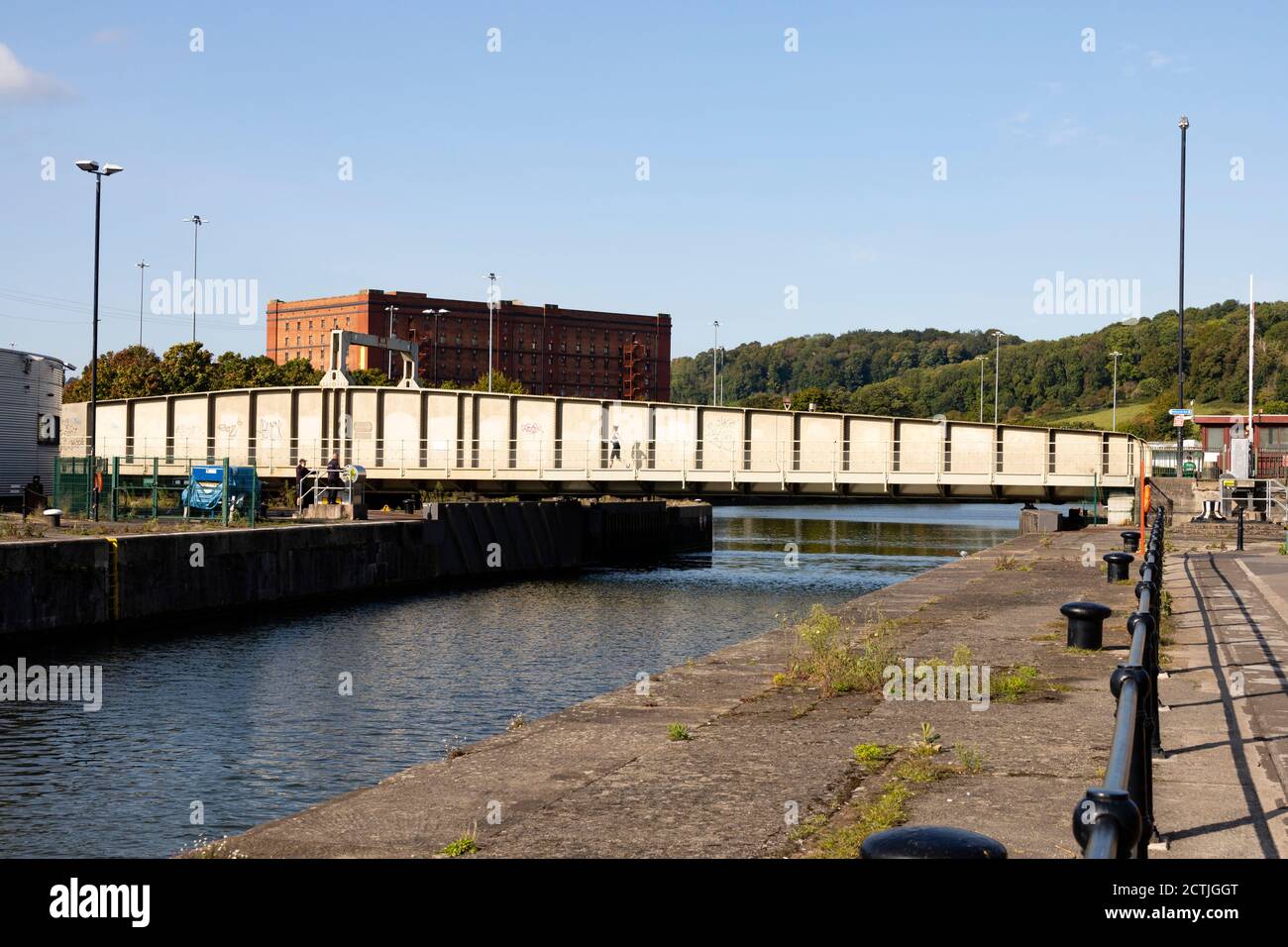 Merchants Road swing bridge and lock gates open for a boat to pass into