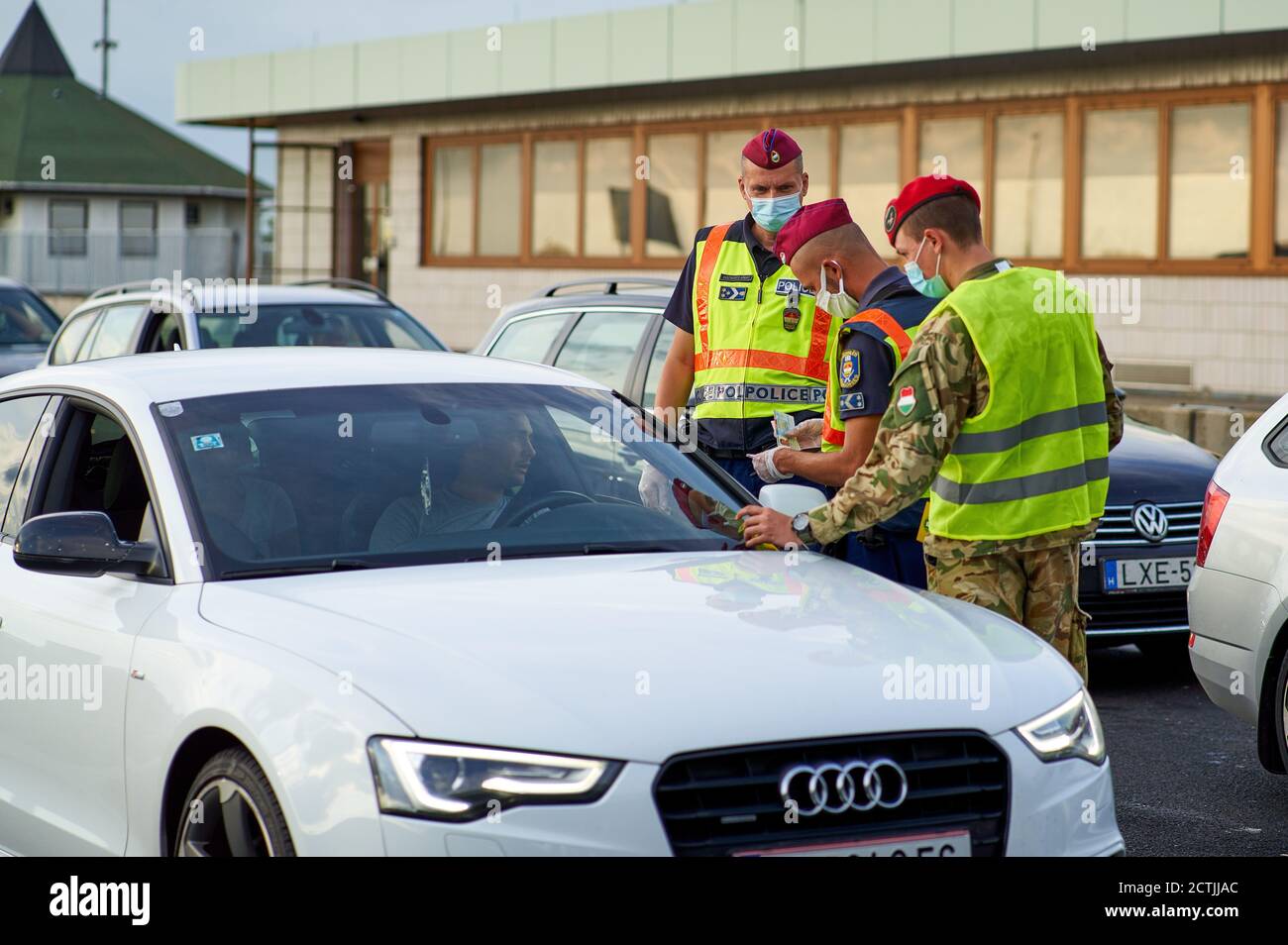 Hegyeshalom, Hungary, 23rd September 2020. Policemen control travelers at the border Austria Hungary, due to high corona infection rate and the Supercup match FC Bayern Munich - FC Sevilla the next day © Peter Schatz / Alamy Live News Stock Photo