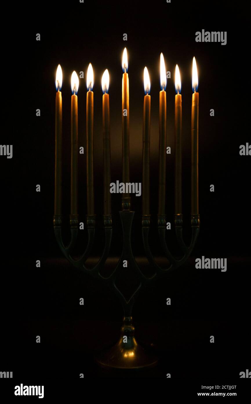 Gold Candles lit in Hanukah Menorah Stock Photo Alamy