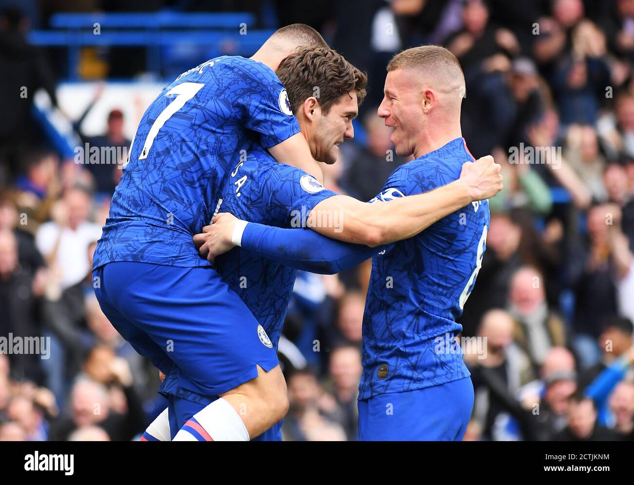 LONDON, ENGLAND - FEBRUARY 22, 2020: Marcos Alonso of Chelsea celebrates with Ross Barkley of Chelsea and Mateo Kovacic of Chelsea  after a goal scored during the 2019/20 Premier League game between Chelsea FC and Tottenham Hotspur FC at Stamford Bridge. Stock Photo