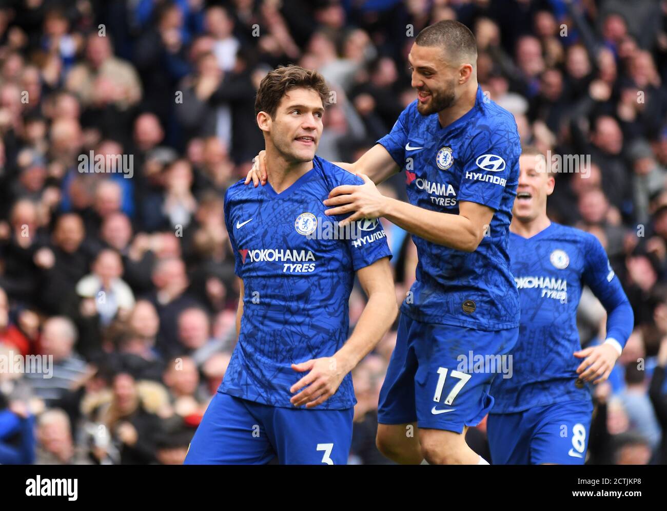 LONDON, ENGLAND - FEBRUARY 22, 2020: Marcos Alonso of Chelsea celebrates with Mateo Kovacic of Chelsea after he scored a goal during the 2019/20 Premier League game between Chelsea FC and Tottenham Hotspur FC at Stamford Bridge. Stock Photo