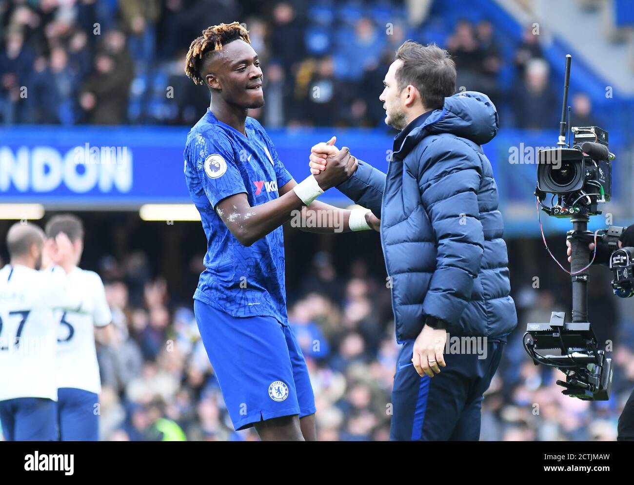 LONDON, ENGLAND - FEBRUARY 22, 2020: Tammy Abraham of Chelsea and Chelsea manager Frank Lampard pictured at the end of the 2019/20 Premier League game between Chelsea FC and Tottenham Hotspur FC at Stamford Bridge. Stock Photo