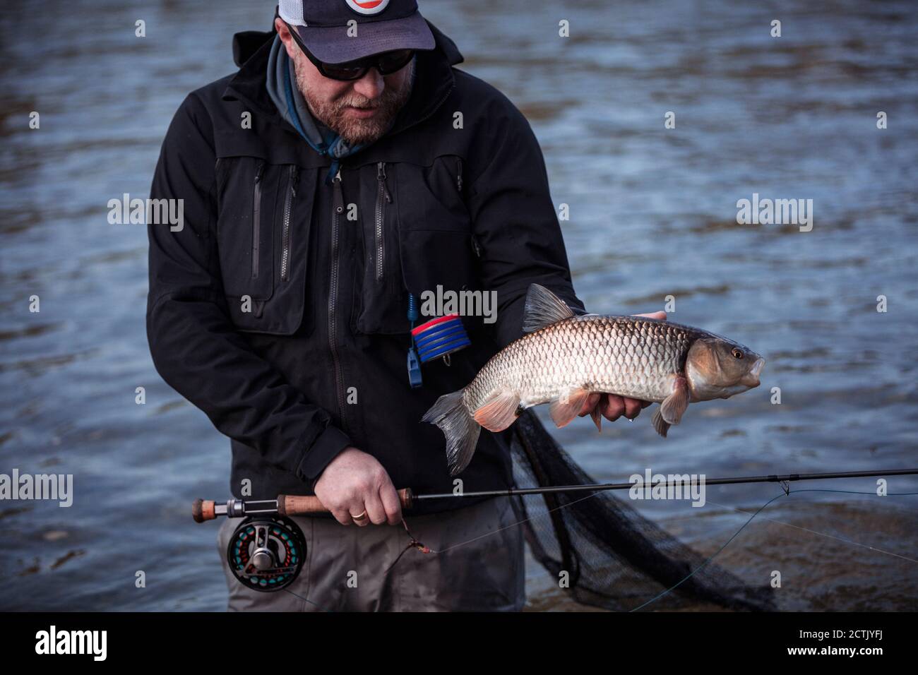 Fisherman holding fish hi-res stock photography and images - Alamy