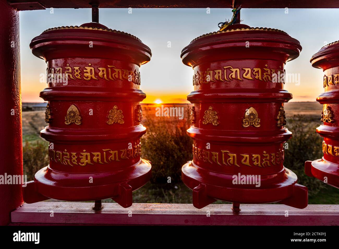 Russia, Republic of Kalmykia, Elista, Prayer wheels in Geden Sheddup Choikorling Monastery at sunset Stock Photo