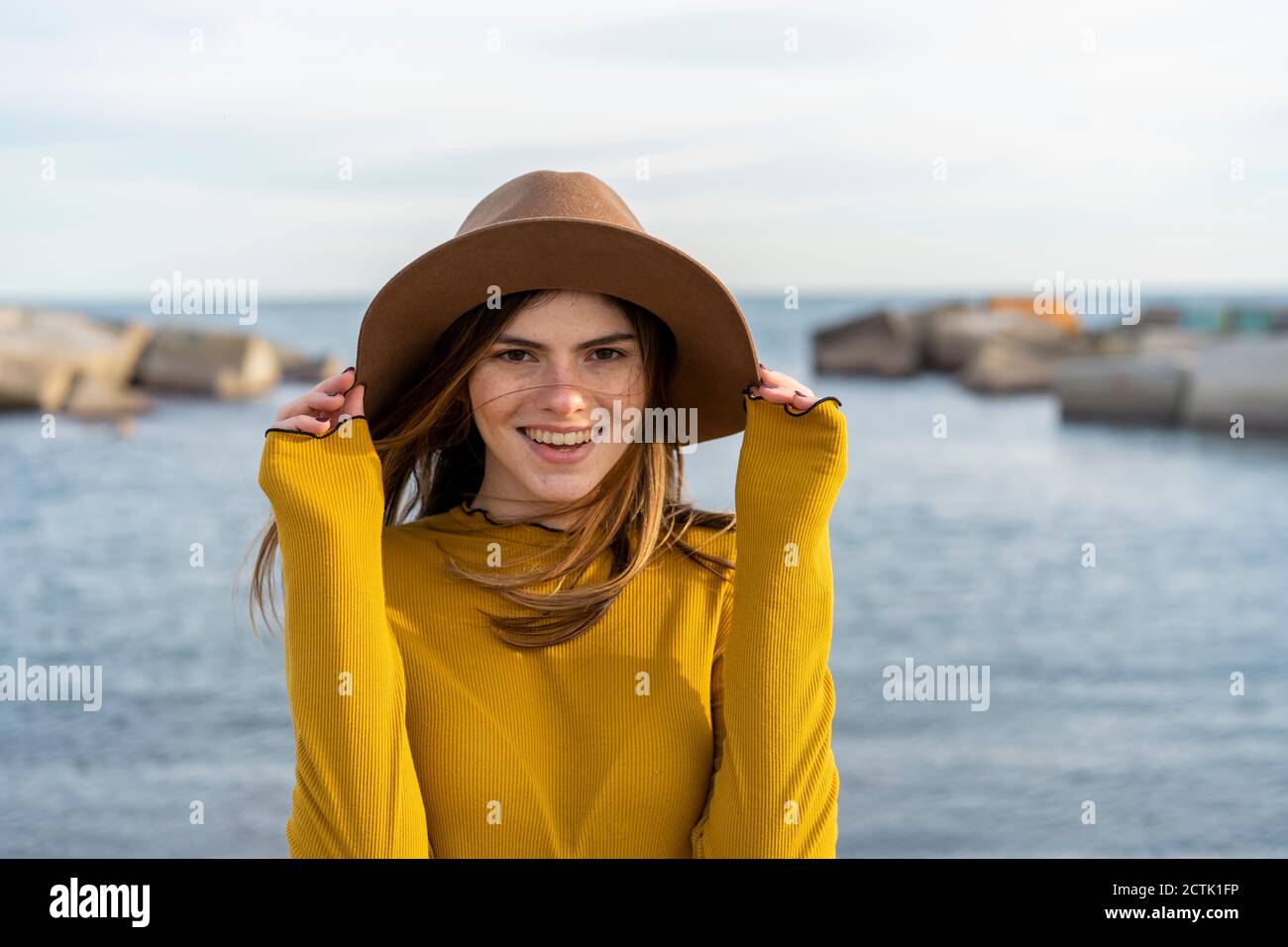 Woman wearing sun hat hi-res stock photography and images - Alamy