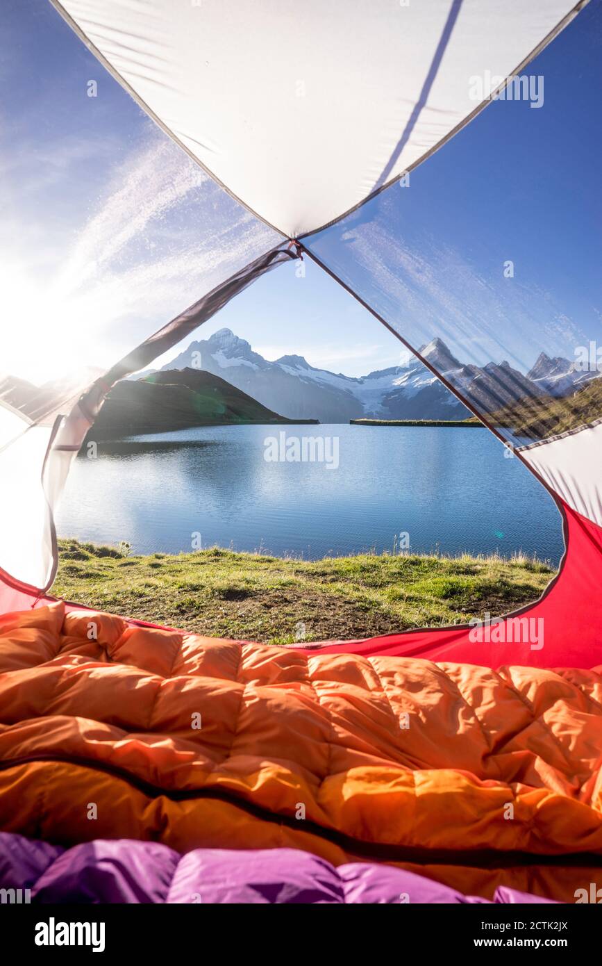 Tent pitched on shore of Bachalpsee at sunrise Stock Photo
