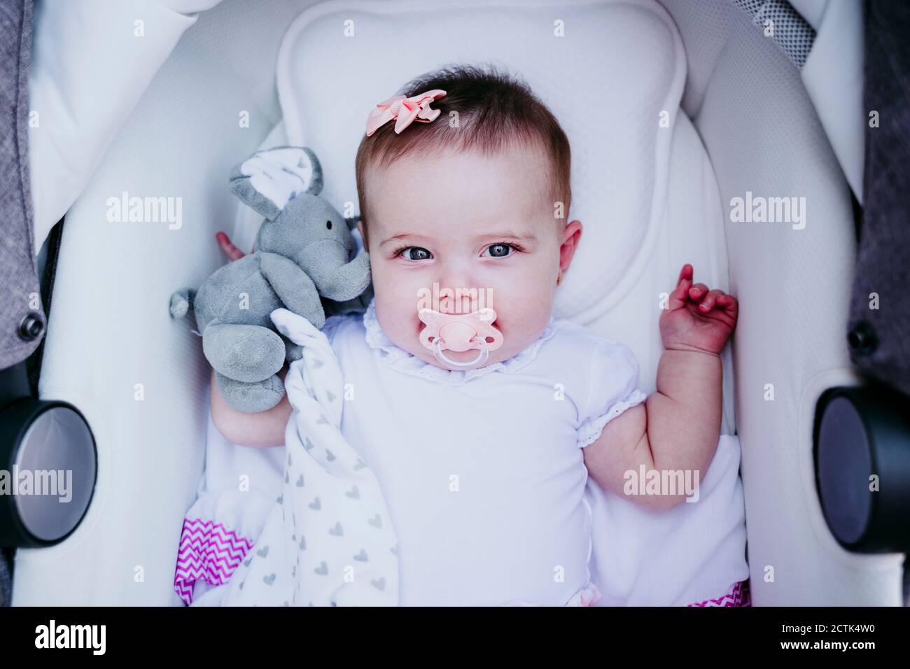 Happy Baby Girl Lying In Stroller Stock Photo Alamy