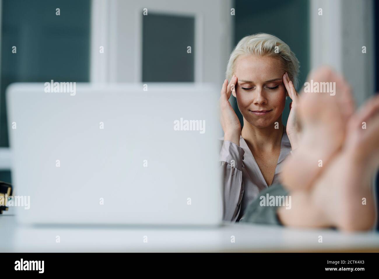 Woman head in hands office desk hi-res stock photography and images - Alamy