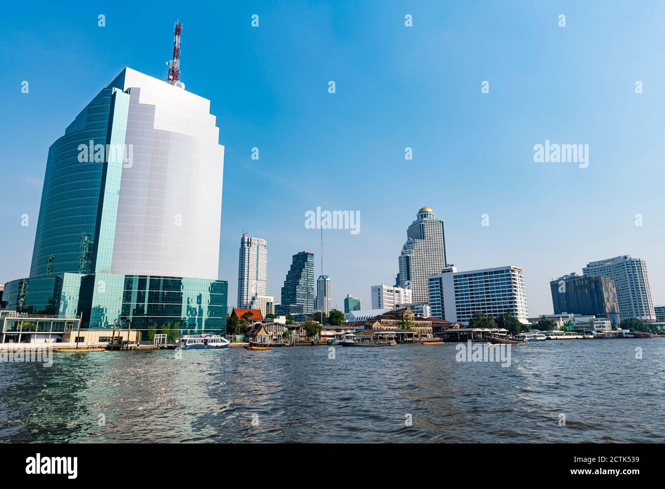Thailand, Bangkok, Chao Phraya river and waterfront skyscrapers Stock Photo