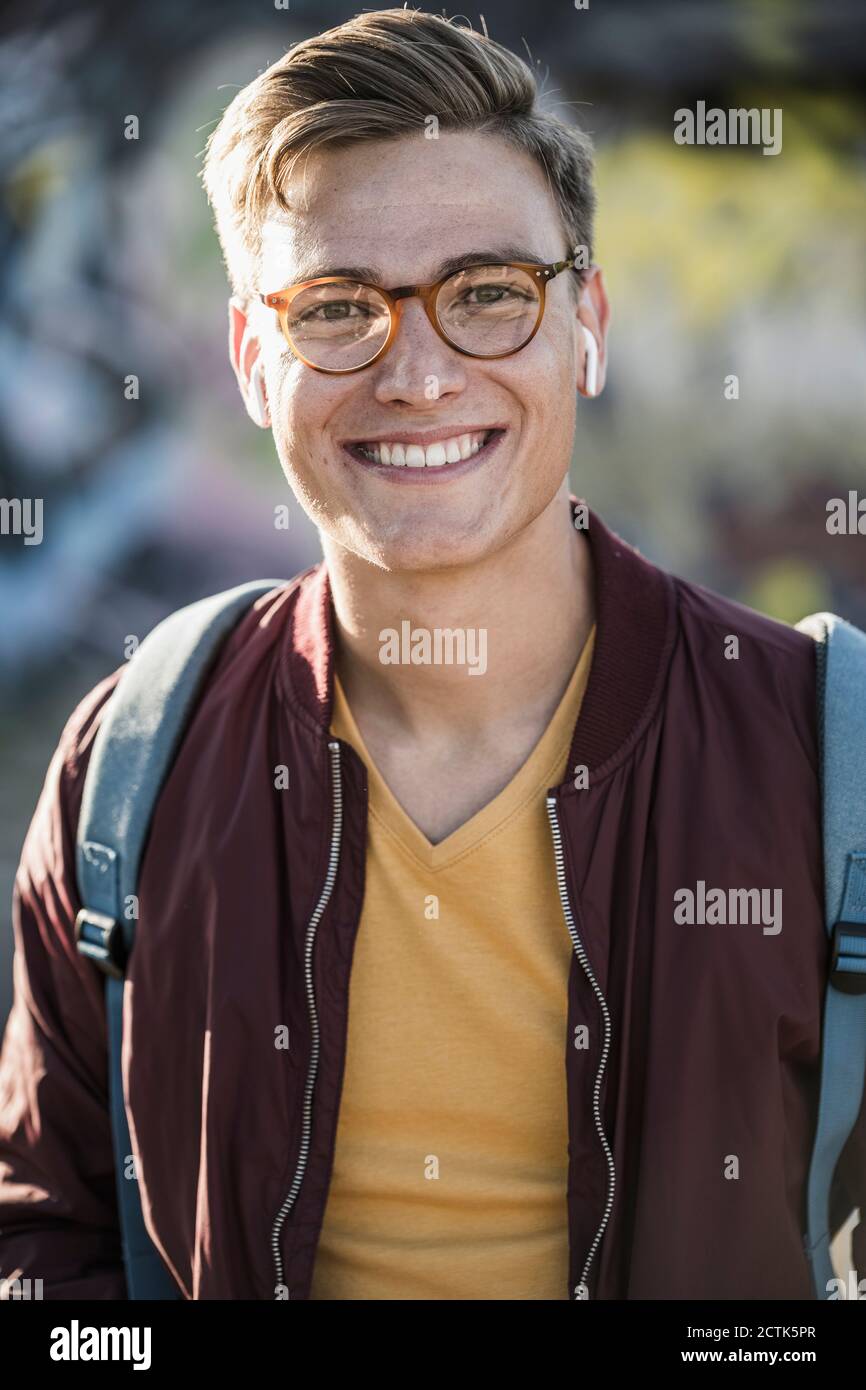 Smiling handsome young man wearing eyeglasses Stock Photo