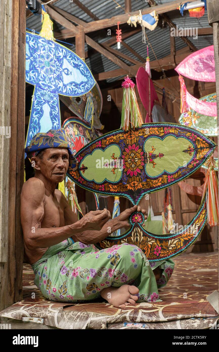 Kota Bahru, Kelantan/Malaysia - Jul 15 2017: Moon kite maker hold the wau. Stock Photo