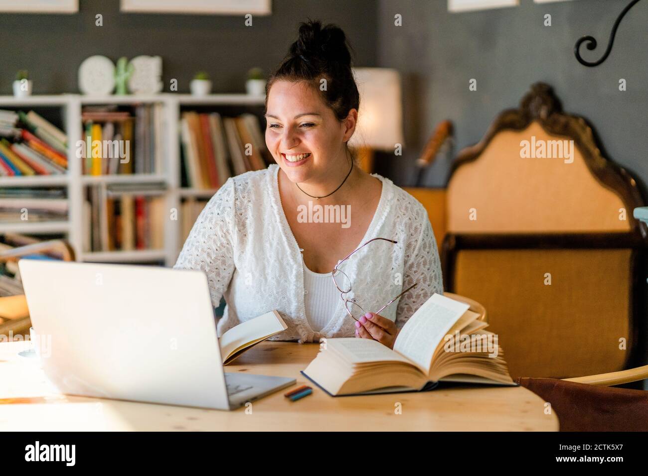 Young student studying with books hi-res stock photography and images ...
