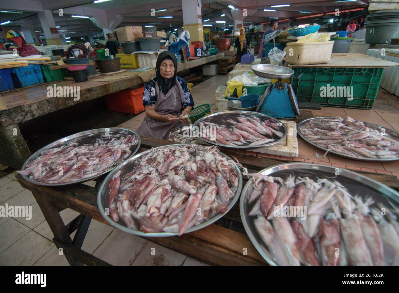 Kota Bahru, Kelantan/Malaysia - Jul 15 2017: A woman sell squid at Pasar Siti Khadijah. Stock Photo