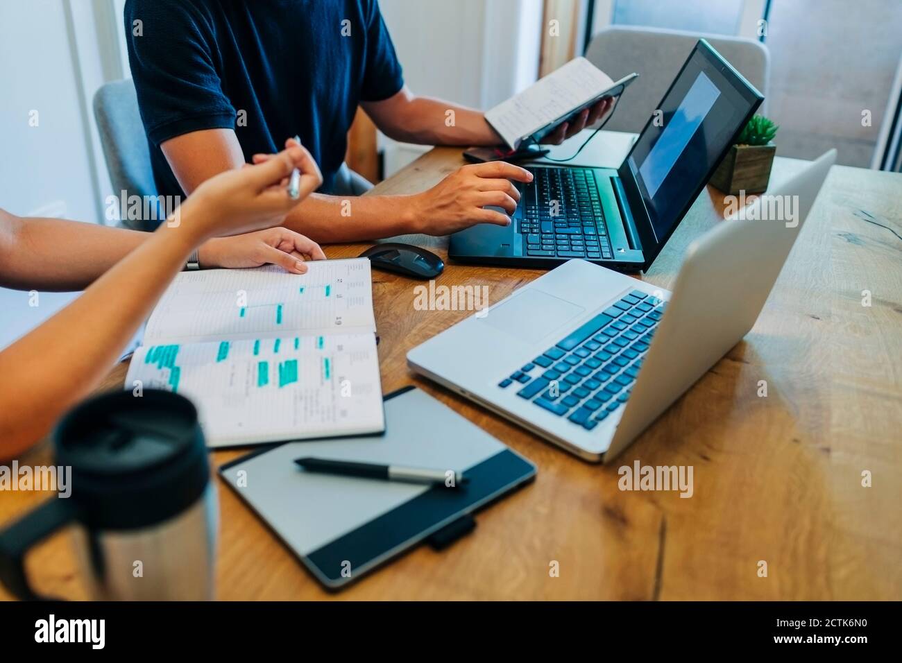 Computer programmers discussing hi-res stock photography and images - Alamy