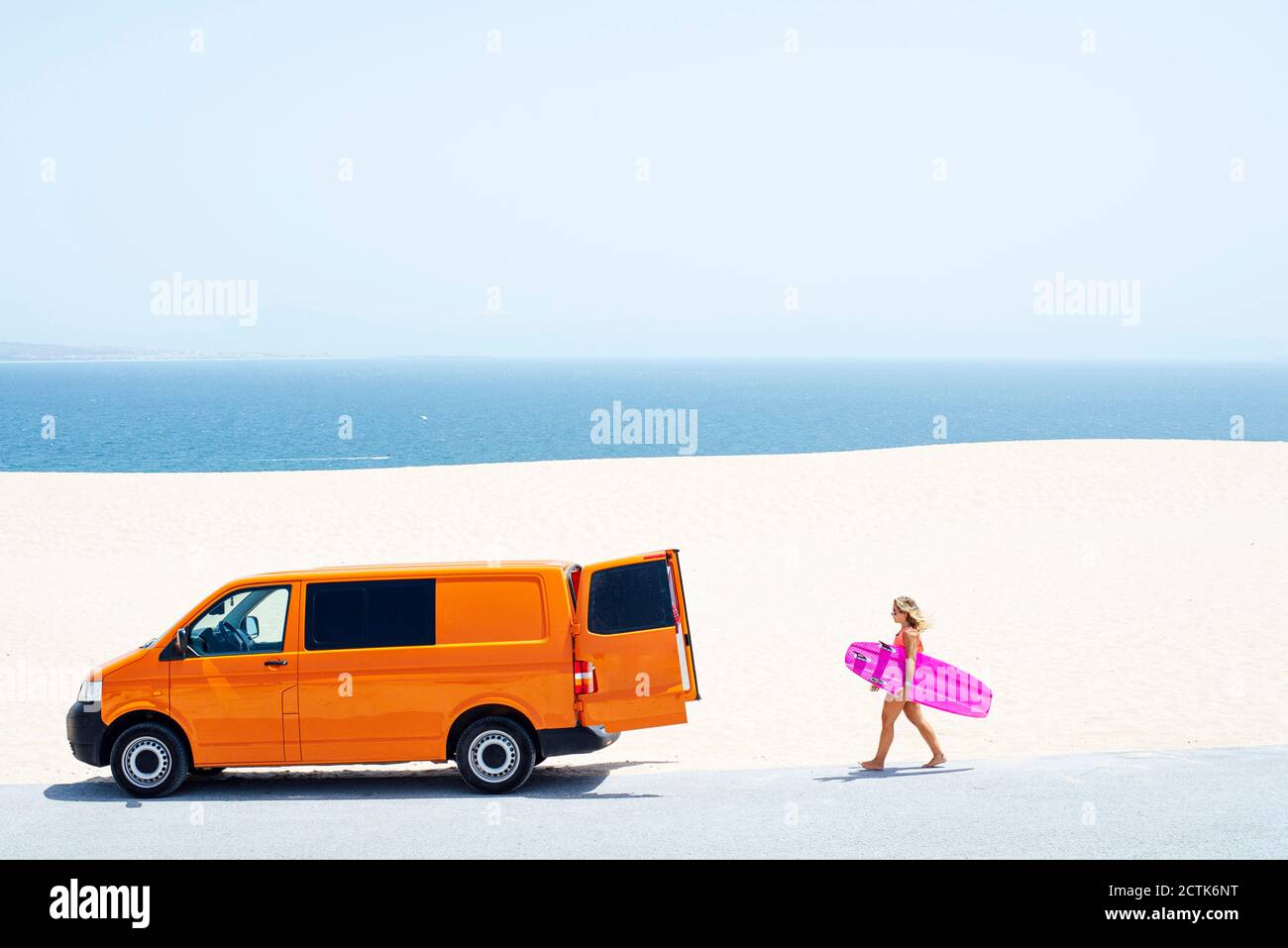 Young women holding surfboard hi-res stock photography and images - Alamy